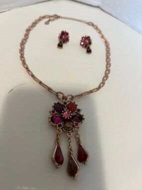 Rose gold flower necklace and earring set.